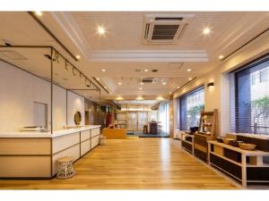 an office lobby with a reception desk and a large window at The One Five Fukuoka Tenjin - Vacation STAY 40121v in Fukuoka