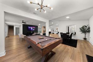 a living room with a pool table in it at Spacious 6 Bed House Pet Friendly AFB in San Antonio