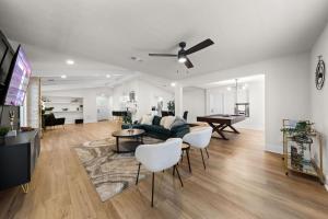 a living room with a couch and a table at Spacious 6 Bed House Pet Friendly AFB in San Antonio