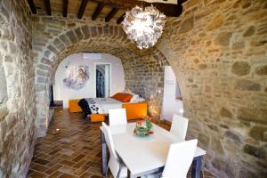 a room with a bed and a table and chairs at Umbria nel cuore in Cannara