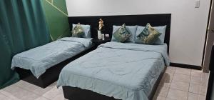 Postel nebo postele na pokoji v ubytování BZ Hostel Cebu