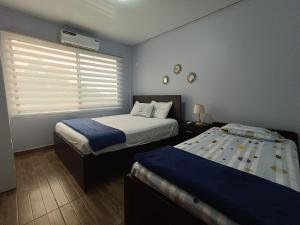 Letto o letti in una camera di L'Vanna Hotel