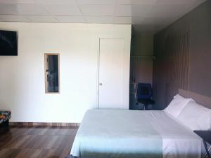 Postel nebo postele na pokoji v ubytování La casita de Issa via Boquete