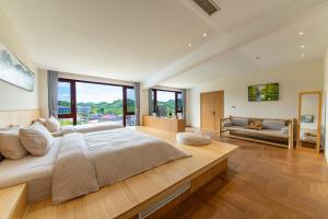 Postel nebo postele na pokoji v ubytování Anji Bamboo Homestay + 37 fotografií