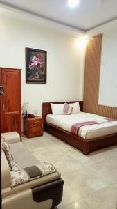 Voodi või voodid majutusasutuse Hoang Quan Hotel toas