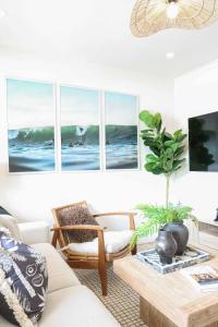 a living room with a couch and a table at Oceanview Oasis W Hot Tub 15-min Walk To Beach in Oceanside