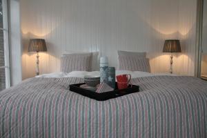 En eller flere senge i et værelse på Villa Humlebæk B&B