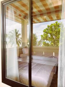Postel nebo postele na pokoji v ubytování Aloha Guest House Nias