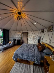 Postel nebo postele na pokoji v ubytování Mountain Home Kaokho เมาท์เท่นโฮม เขาค้อ