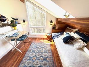 a bedroom with a bed and a window and a desk at Cape Cod Villa in Harwich +37 photos