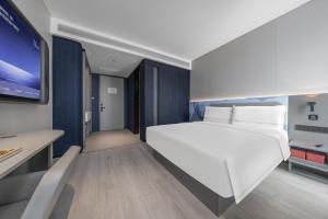 Katil atau katil-katil dalam bilik di Atour Light Hotel Zhuhai Xiangzhou Mingzhu Station