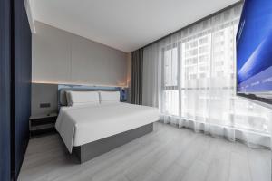 Katil atau katil-katil dalam bilik di Atour Light Hotel Zhuhai Xiangzhou Mingzhu Station