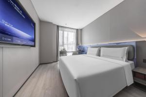 Katil atau katil-katil dalam bilik di Atour Light Hotel Zhuhai Xiangzhou Mingzhu Station