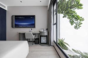 Televisyen dan/atau pusat hiburan di Atour Light Hotel Zhuhai Xiangzhou Mingzhu Station