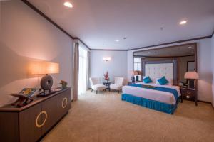 Ein Bett oder Betten in einem Zimmer der Unterkunft Adya Hotel Langkawi