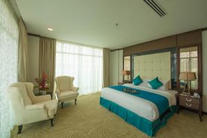 Ein Bett oder Betten in einem Zimmer der Unterkunft Adya Hotel Langkawi