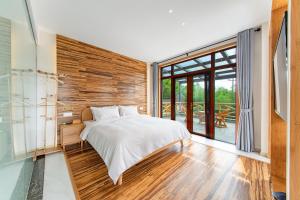 Postel nebo postele na pokoji v ubytování Anji Bamboo Homestay