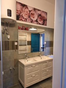 a bathroom with a sink and a mirror at Heart House Szív Ház in Nagymaros +116 photos