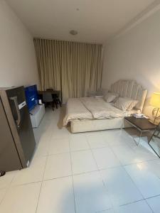 Ένα ή περισσότερα κρεβάτια σε δωμάτιο στο Fam building smart tower