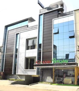 a large glass building with a grand view at Hotel Grand Parkway in Tambaram