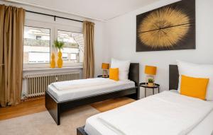 En eller flere senge i et værelse på Gemütliche 2 Zimmerwohnung für 4