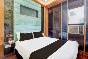 Palette Swaroop Nagar Formerly Shanti Kutir客房内的一张或多张床位
