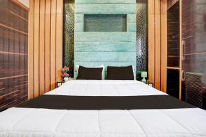 Palette Swaroop Nagar Formerly Shanti Kutir客房内的一张或多张床位