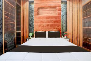 Palette Swaroop Nagar Formerly Shanti Kutir客房内的一张或多张床位