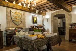 a table with bowls of food on top of it at Three Crowns Residents in Tallinn