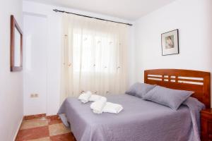 Ένα ή περισσότερα κρεβάτια σε δωμάτιο στο Apartamentos Sol Andaluz