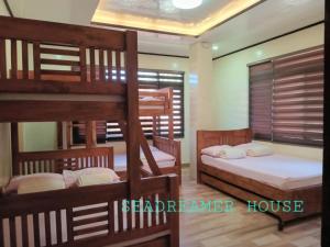 a room with three bunk beds in a house at Sea Dreamer House 2 in Baguio