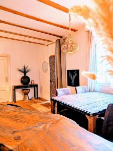 A bed or beds in a room at Esencia Lodge - luxurious off-grid cabin retreat
