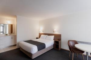 Postel nebo postele na pokoji v ubytování Argyle Motor Lodge