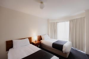 Postel nebo postele na pokoji v ubytování Argyle Motor Lodge