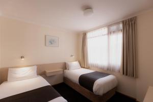 Postel nebo postele na pokoji v ubytování Argyle Motor Lodge