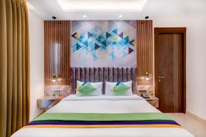 Ένα ή περισσότερα κρεβάτια σε δωμάτιο στο Treebo Corporate Inn +37 φωτογραφίες