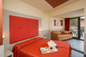 
Кровать или кровати в номере Hotel Sole Malcesine
