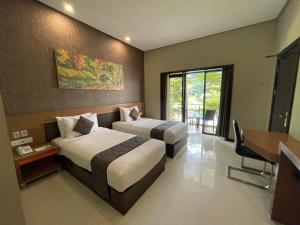 Katil atau katil-katil dalam bilik di Samara Resort