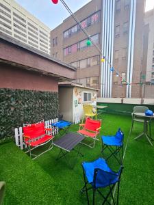 a group of chairs and a table on a lawn at Space Stay in Seoul +11 photos