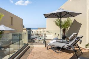 Балкон или терраса в Dea Del Porto Wellness & Spa Suites