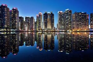 a view of a city at night with its lights at Stay Busan in Busan