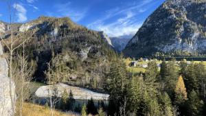 a valley in the mountains with a body of water at Quellhuette Dachbodn in Weichselboden