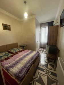 Postel nebo postele na pokoji v ubytování FIROSMANI house