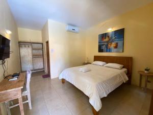 Ein Bett oder Betten in einem Zimmer der Unterkunft Sama Sama Bungalows