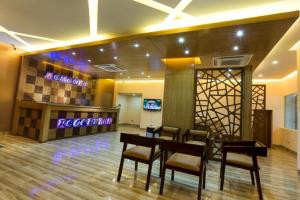 a restaurant with a table and chairs in a room at Memento Residence in Dhaka +14 photos