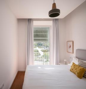 A bed or beds in a room at Don Fadrique Apartments by Olala Homes