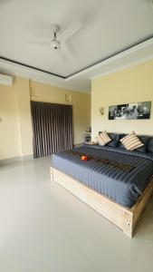a bedroom with a large bed in a room at Sarwhe Nadi Homestay in Sidemen +28 photos