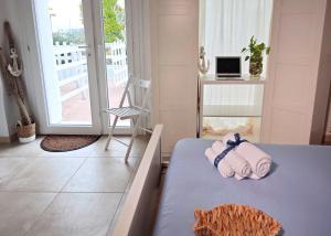 Postel nebo postele na pokoji v ubytování Casa del mare
