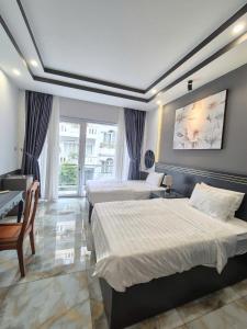 Postel nebo postele na pokoji v ubytování GALANG HOTEL