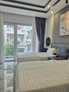Postel nebo postele na pokoji v ubytování GALANG HOTEL